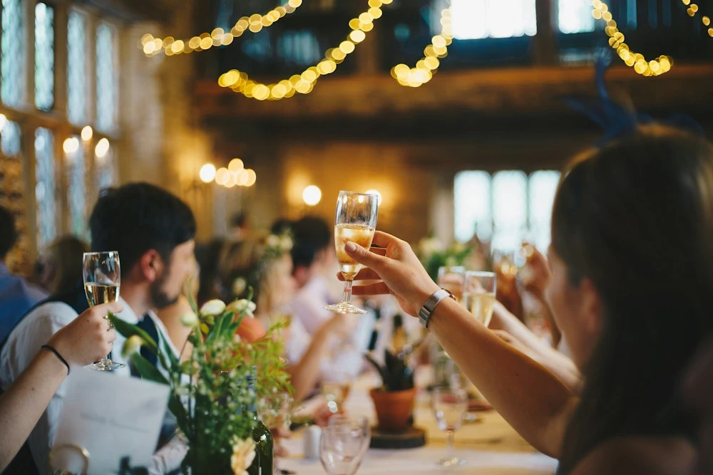 Friends raising their glasses at a celebration